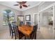 Dining room with an arch window that allows natural light and views of the yard at 5501 E Longboat Blvd, Tampa, FL 33615