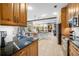 Gourmet kitchen with granite counters, stainless appliances and backyard view at 5501 E Longboat Blvd, Tampa, FL 33615