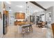 Bright kitchen with a large island, stainless appliances, and a dining table at 5501 E Longboat Blvd, Tampa, FL 33615