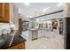 Open kitchen view with large island, stainless steel appliances, and access to the living area at 5501 E Longboat Blvd, Tampa, FL 33615