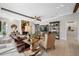 Inviting living room with beam ceiling, neutral palette, and tile flooring at 5501 E Longboat Blvd, Tampa, FL 33615