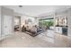 Open living area with access to screened-in porch, and an adjacent bar with wine storage at 5501 E Longboat Blvd, Tampa, FL 33615