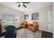 Cozy home office features comfortable leather chairs, a side table, and bright windows at 5501 E Longboat Blvd, Tampa, FL 33615