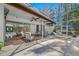 Spacious covered patio with a screen enclosure, comfortable seating, and outdoor fans at 5501 E Longboat Blvd, Tampa, FL 33615