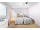 This bedroom features twin beds with ceiling fan and neutral color palette at 5603 80Th N St # 512, St Petersburg, FL 33709