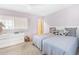 This bedroom features twin beds and a dresser with a window at 5603 80Th N St # 512, St Petersburg, FL 33709