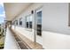 Condo building exterior featuring pathway and unit 512's front door at 5603 80Th N St # 512, St Petersburg, FL 33709