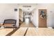 Well-lit hallway entrance to the property with visible unit numbers and a seating bench at 5603 80Th N St # 512, St Petersburg, FL 33709