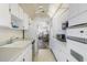 Efficient kitchen with white cabinetry and appliances at 5603 80Th N St # 512, St Petersburg, FL 33709