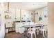 Bright laundry room equipped with multiple washing machines, a sink, and a folding table for convenience at 5603 80Th N St # 512, St Petersburg, FL 33709