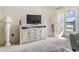 Living room featuring TV console and patio door at 5603 80Th N St # 512, St Petersburg, FL 33709