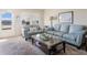 Bright living room with comfortable seating and a glass coffee table at 5603 80Th N St # 512, St Petersburg, FL 33709