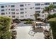 Charming community patio with seating, tables, and mature landscaping enhancing the outdoor experience at 5603 80Th N St # 512, St Petersburg, FL 33709