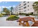 Inviting courtyard area with a picnic table and well-maintained landscaping offering a relaxing outdoor space at 5603 80Th N St # 512, St Petersburg, FL 33709
