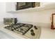 Gas cooktop with four burners and stainless steel trim, perfect for preparing delicious meals at home at 5603 80Th N St # 512, St Petersburg, FL 33709