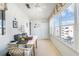 Bright sunroom featuring large windows offering expansive views and a perfect home office setup at 5603 80Th N St # 512, St Petersburg, FL 33709