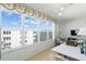 This sunroom has a large window with a view, along with a ceiling fan at 5603 80Th N St # 512, St Petersburg, FL 33709
