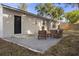 Backyard with paver patio and comfortable outdoor seating at 5802 N Suwanee Ave, Tampa, FL 33604