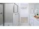 Modern bathroom with double vanity, shower and linen closet at 6238 Timberdale Ave, Wesley Chapel, FL 33545