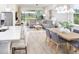 Open concept dining area with adjacent kitchen and living room at 6238 Timberdale Ave, Wesley Chapel, FL 33545