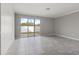 Bright, open living area with sliding glass doors leading to the backyard at 7055 Summer Holly Pl, Riverview, FL 33578