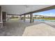Spacious covered patio area by the community pool with stone columns and ample room for residents at 7055 Summer Holly Pl, Riverview, FL 33578