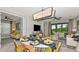 Stylish open-concept living space combining living and dining areas, with view to the outdoor pool at 750 Steel Dr, Apollo Beach, FL 33572
