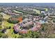 Aerial view showcases this condo in a community nestled among lush greenery and winding waterways at 7532 Marsh Orchid Cir # 8-201, Bradenton, FL 34203