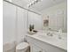 Bathroom featuring a vanity with a sink, toilet, and a shower with white shower curtain at 7532 Marsh Orchid Cir # 8-201, Bradenton, FL 34203