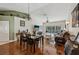 Spacious room with living and dining areas, hardwood floors, and sliding door to the balcony at 7532 Marsh Orchid Cir # 8-201, Bradenton, FL 34203