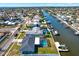 An aerial view showing waterfront homes along a canal, each with private docks and screened in pools at 8421 Flagstone Dr, Tampa, FL 33615