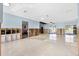 Open-concept living area with ceramic floors and sliding glass doors leading to the backyard and pool area at 8421 Flagstone Dr, Tampa, FL 33615