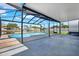 Screened-in pool with spacious patio area overlooking the canal at 8421 Flagstone Dr, Tampa, FL 33615