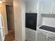 Cozy kitchen featuring white cabinetry, drawers, and built-in oven at 2042 Australia W Way # 74, Clearwater, FL 33763