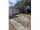 Large backyard offers space for gardening, recreation, or entertaining, enhanced by a shed at 10120 N Aster Ave, Tampa, FL 33612