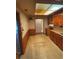 This kitchen features wood cabinets, butcher block countertops and a stainless-steel sink at 10120 N Aster Ave, Tampa, FL 33612