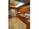 This kitchen features wood cabinets, butcher block countertops and a stainless-steel sink at 10120 N Aster Ave, Tampa, FL 33612