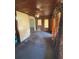 Living room features a ceiling fan and patterned curtains at 10120 N Aster Ave, Tampa, FL 33612