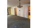 Living room featuring a chandelier and a view into the kitchen at 10120 N Aster Ave, Tampa, FL 33612