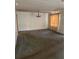 Large living room with classic chandelier and natural light from a nearby window at 10120 N Aster Ave, Tampa, FL 33612