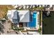 Overhead view of resort pool with neatly arranged lounge chairs alongside a community clubhouse at 1021 Seagrape Dr, Ruskin, FL 33570