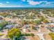 Aerial view of a single-Gathering home in a residential neighborhood featuring mature trees and landscaping at 10261 Horizon Dr, Spring Hill, FL 34608