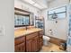 Well-lit bathroom with granite counters and wooden cabinets at 10261 Horizon Dr, Spring Hill, FL 34608