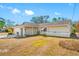 Inviting single-Gathering home with a manicured front lawn and an American flag displayed in the window, showcasing pride at 10261 Horizon Dr, Spring Hill, FL 34608