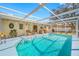 Relaxing screened-in pool area with comfortable seating, ideal for outdoor enjoyment at 10261 Horizon Dr, Spring Hill, FL 34608