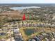 Aerial view showing a home situated in a peaceful lakefront neighborhood at 1045 Tracey Ann Loop, Seffner, FL 33584