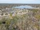 Aerial view showcasing a community near a serene lake at 1045 Tracey Ann Loop, Seffner, FL 33584