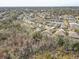 Aerial view of a lakefront community with numerous homes at 1045 Tracey Ann Loop, Seffner, FL 33584