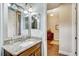 Bathroom with granite vanity and view into another room at 1045 Tracey Ann Loop, Seffner, FL 33584