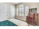 Bedroom with teal comforter, window shutters and dresser at 1045 Tracey Ann Loop, Seffner, FL 33584